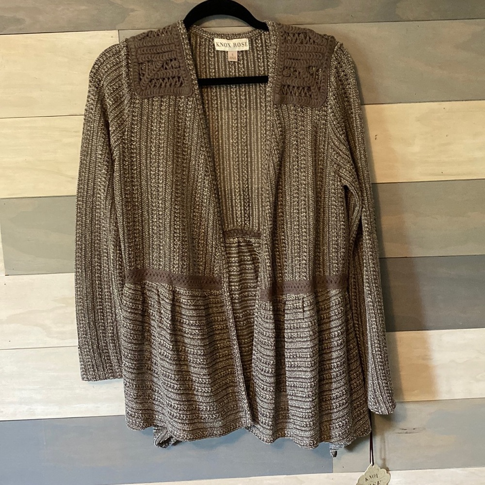 New with tags open front sweater with long sleeve and crocheting. Size L